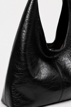 Black Crinkled Faux Leather Hobo Bag texture close up