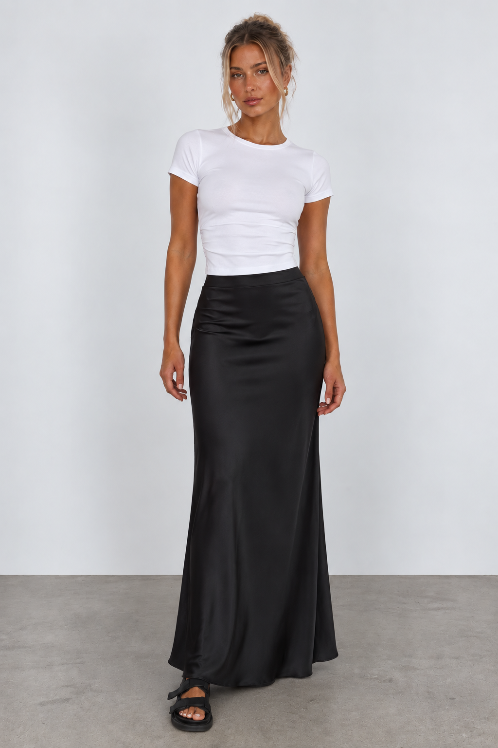 Black flared maxi skirt, full front view on model