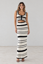 Front view of black and ivory striped crochet crop top and maxi skirt set