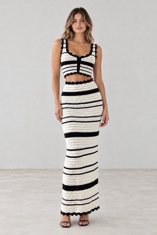 Front view of black and ivory striped crochet crop top and maxi skirt set