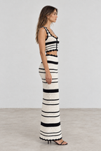 Side view of black and ivory striped crochet skirt set