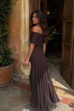 Model wearing Chocolate Mesh Off-Shoulder Maxi Dress holding a woven clutch