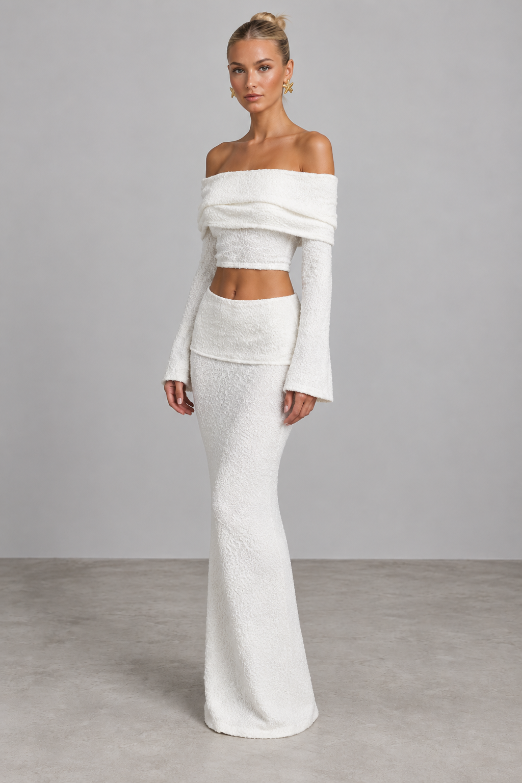 Ivory textured off-shoulder crop top and maxi skirt set, angled view